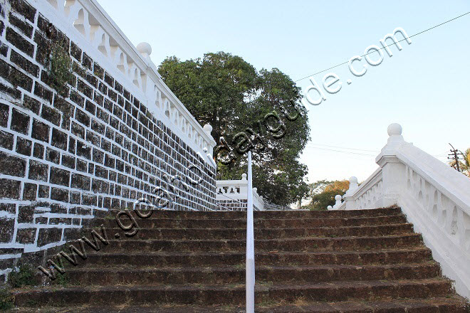 A flight of broad steps lead to an open plain that surrounds the church building